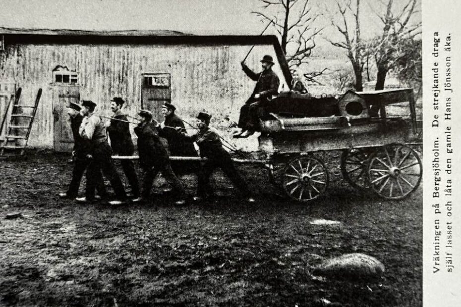 Sex män drar en vagn